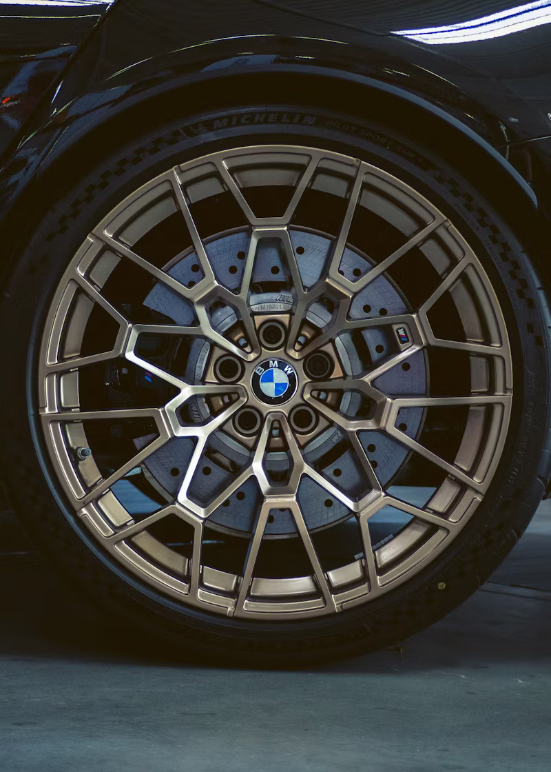 Close-up of a car wheel showing brake rotor and caliper